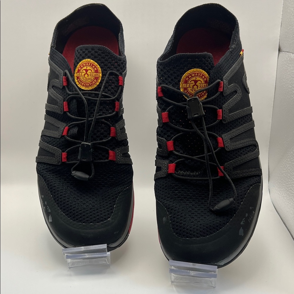 OluKai Men's Black Athletic Shoes with Red Accents and Yellow Logo Patch